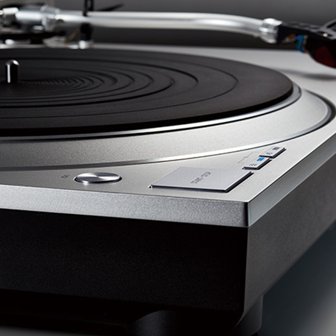 A close up of the Technics Premium Class SL-1500C Direct Drive Turntable in silver from Todds Hi Fi