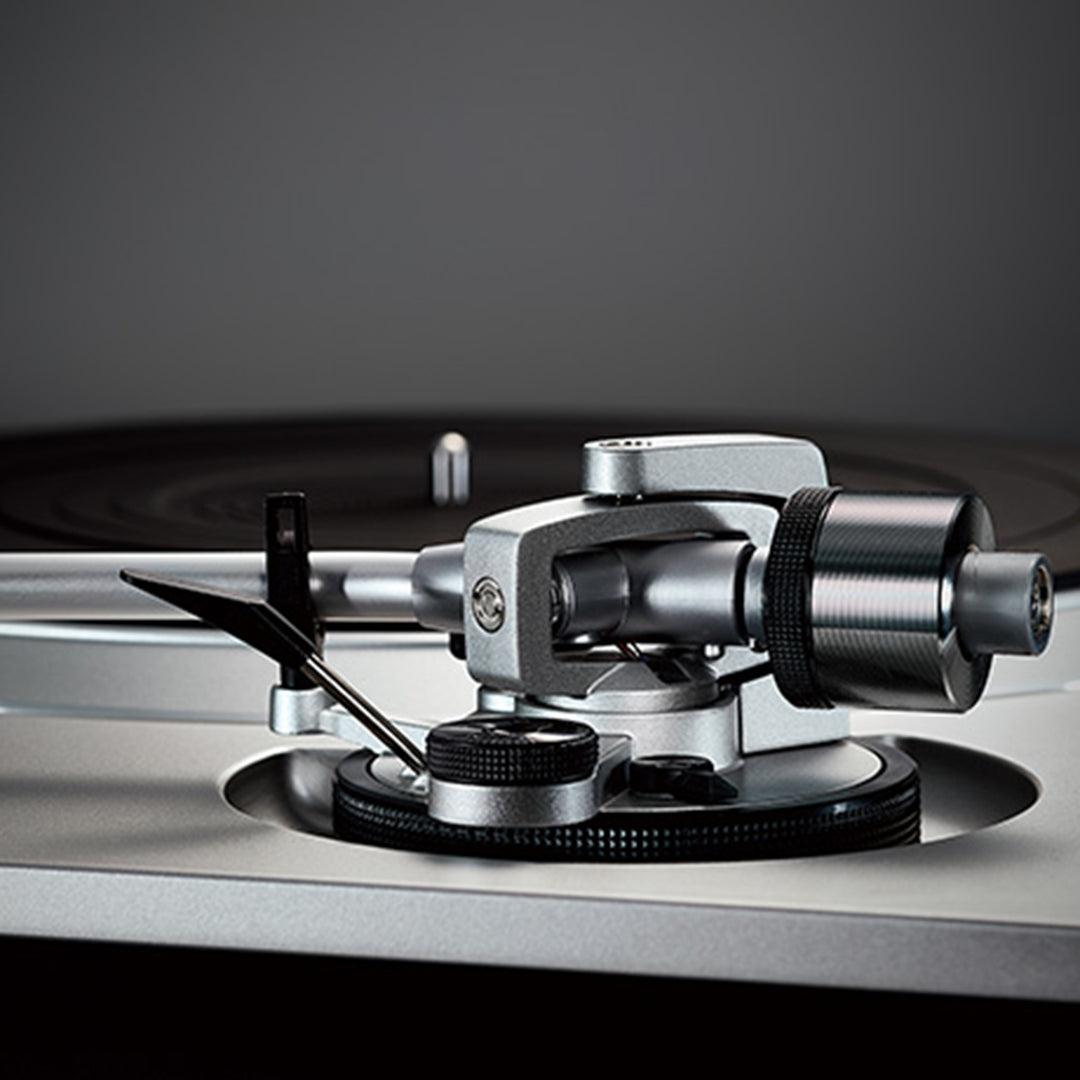 A close up of the Technics Premium Class SL-1500C Direct Drive Turntable in silver from Todds Hi Fi